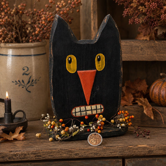 Primitive black cat Halloween decor in rustic country fall setting